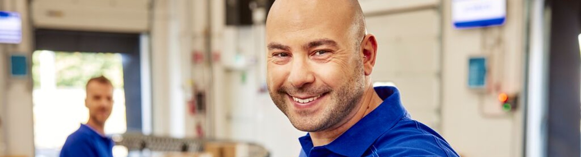 GLS driver smiling at the camera